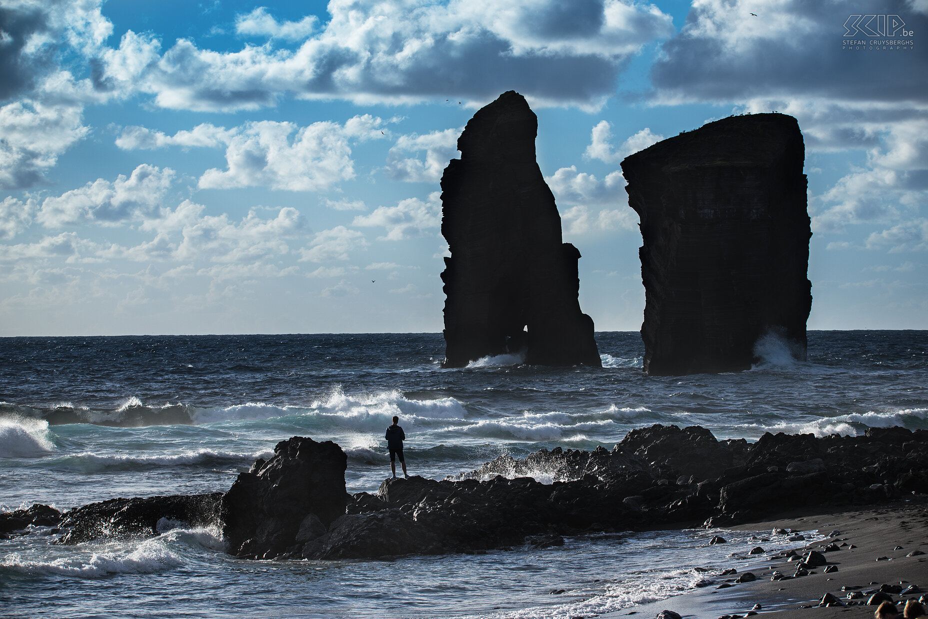 Mosteiros The most western village of São Miguel is Mosteiros. It has impressive cliffs but also a black sand beach. The village is primarily recognizable by a group of islets that lie offshore. The word 'Mosteiros', meaning monastery in Portuguese, was named after the largest islet that is shaped like a church. Stefan Cruysberghs